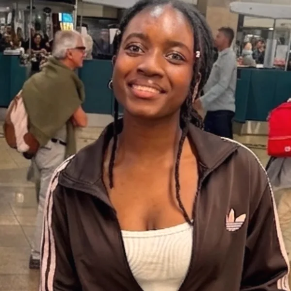 Kianga Simente at the airport, on her way to university